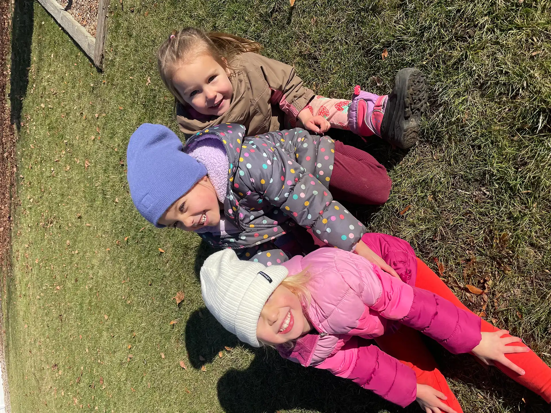 Girls playing outside in the grass