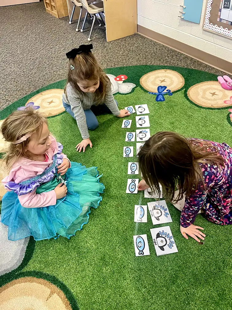 Girls playing cards