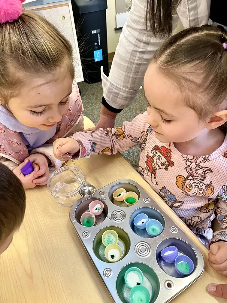 Girls filling eggs